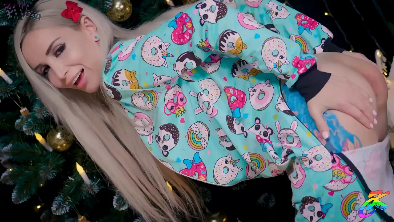 Blonde and brunette in Christmas pajamas play with a big dildo, one gets her asshole