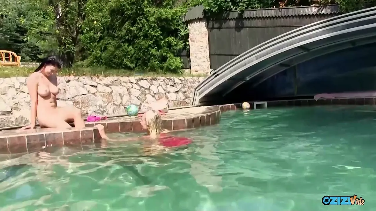 Blonde MILF and her brunette daughter lick each other's pussy at the swimming pool