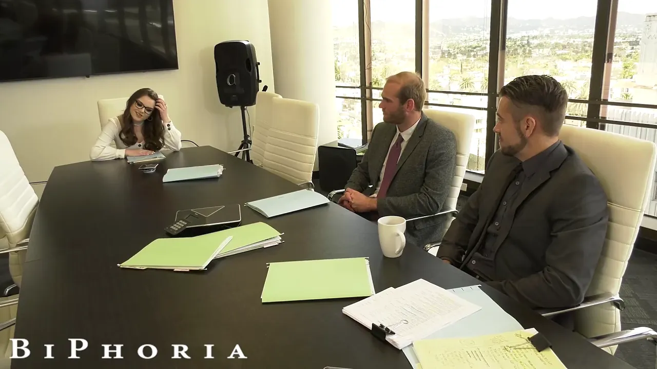 Brunette businesswomen have a bisexual threesome in an office meeting room