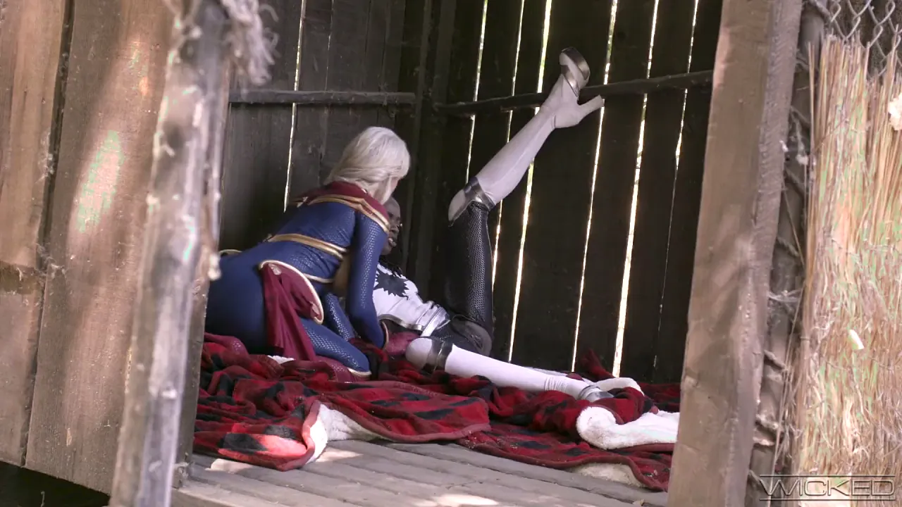Captain Marvel cosplayer Ana Foxxx and brunette Kenzie Taylor lick each other's pussies
