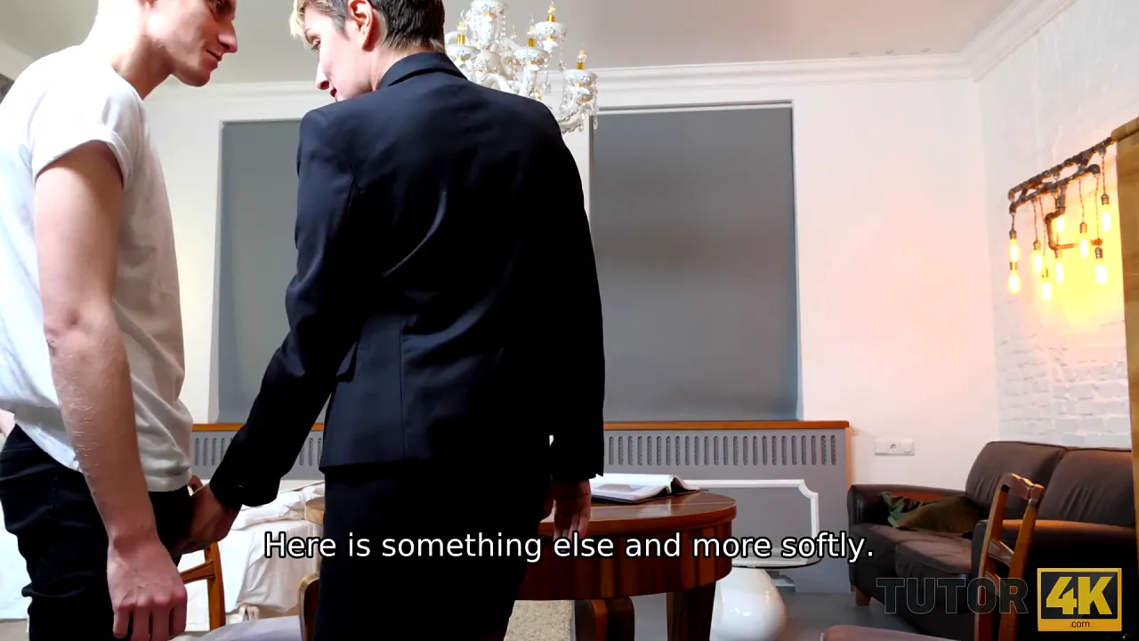 Mature Russian MILF with short hair teaches younger man in role play before sex