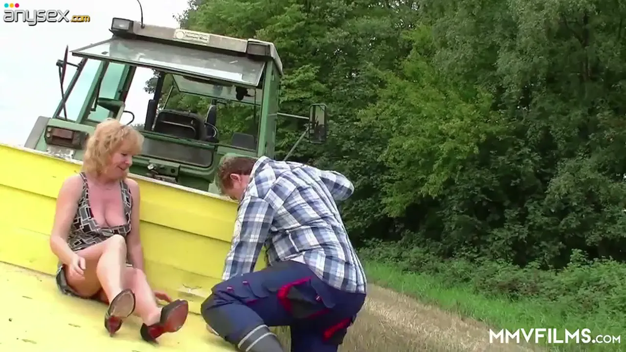 Mature blonde country hooker Frosya gets fucked by a tractor driver in the field