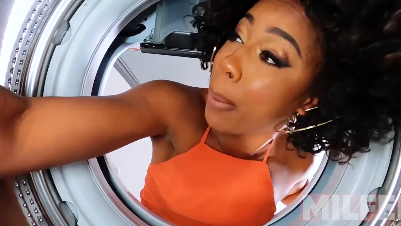 Ebony stepmom Ebony gets stuck in the washing machine and takes a white cock
