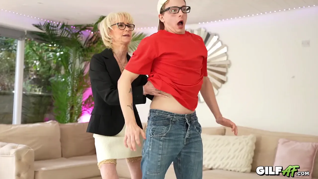 Granny with fake tits teaches naughty schoolboy a lesson