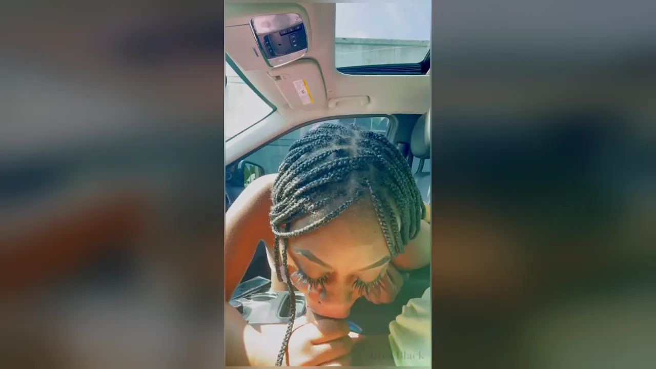 Ebony babe with big tits gets caught sucking a young man's big cock in the parking lot